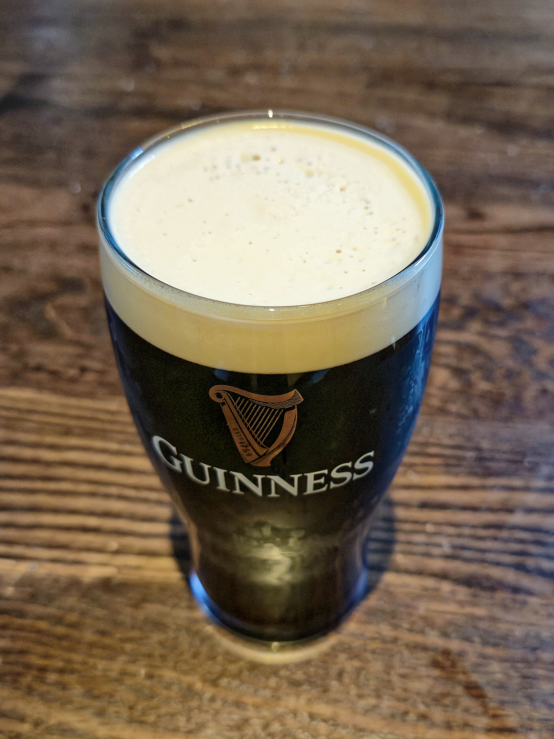 A pint of Guinness on the bar